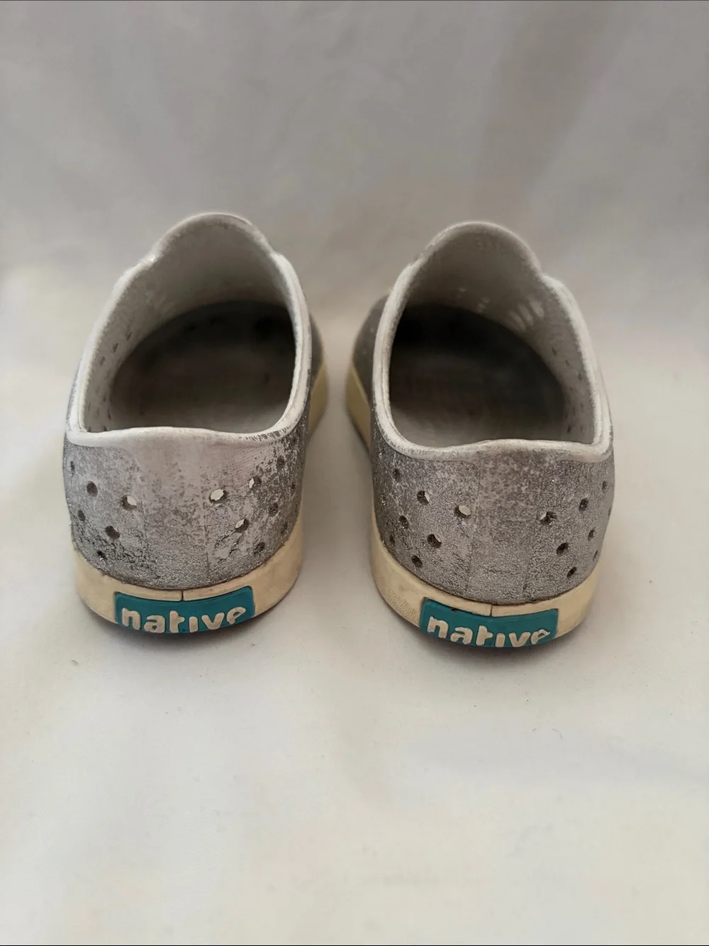 Native Gray Slip-On Kids Shoes with Cream Soles and Teal Heel Logo